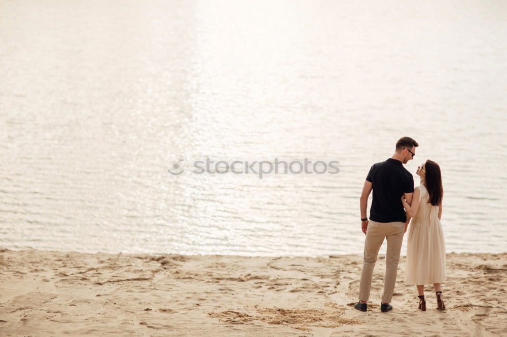 Similar – Bridal couple posing on sunny beach