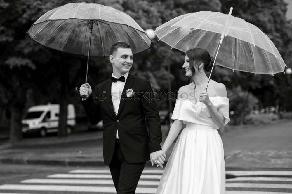 Similar – couple in the rain Elegant