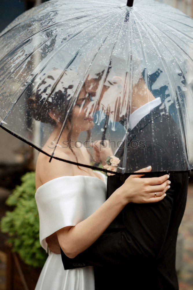 Similar – couple in the rain Elegant