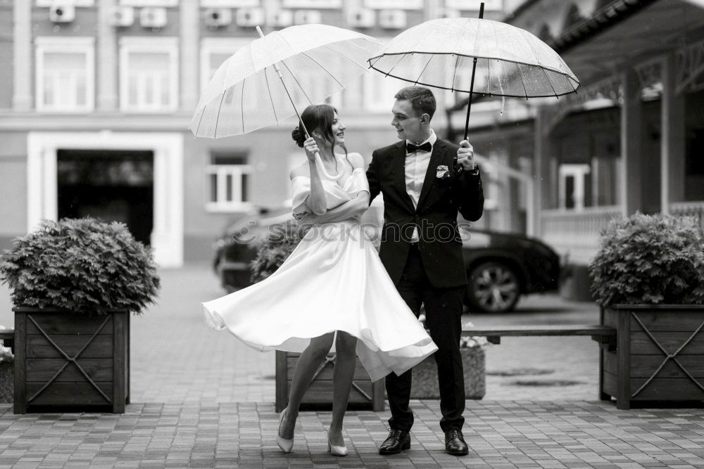 Similar – couple in the rain Elegant