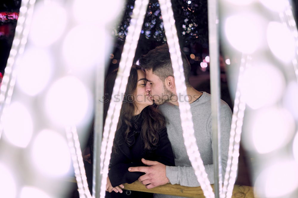 Similar – Couple embracing on evening street