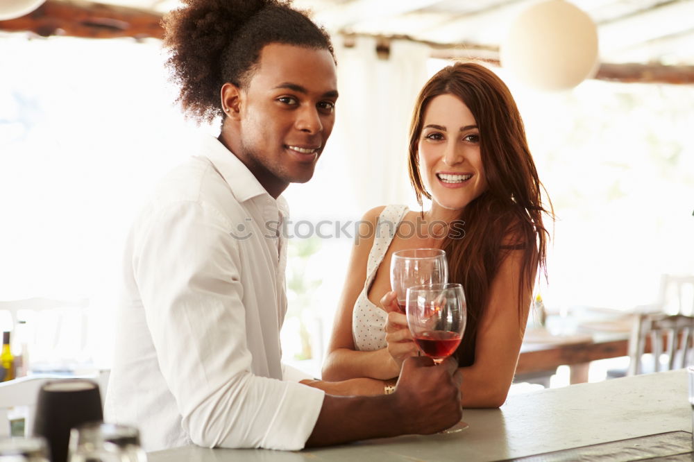 Similar – Cute young adult couple taking photo at outdoor picnic