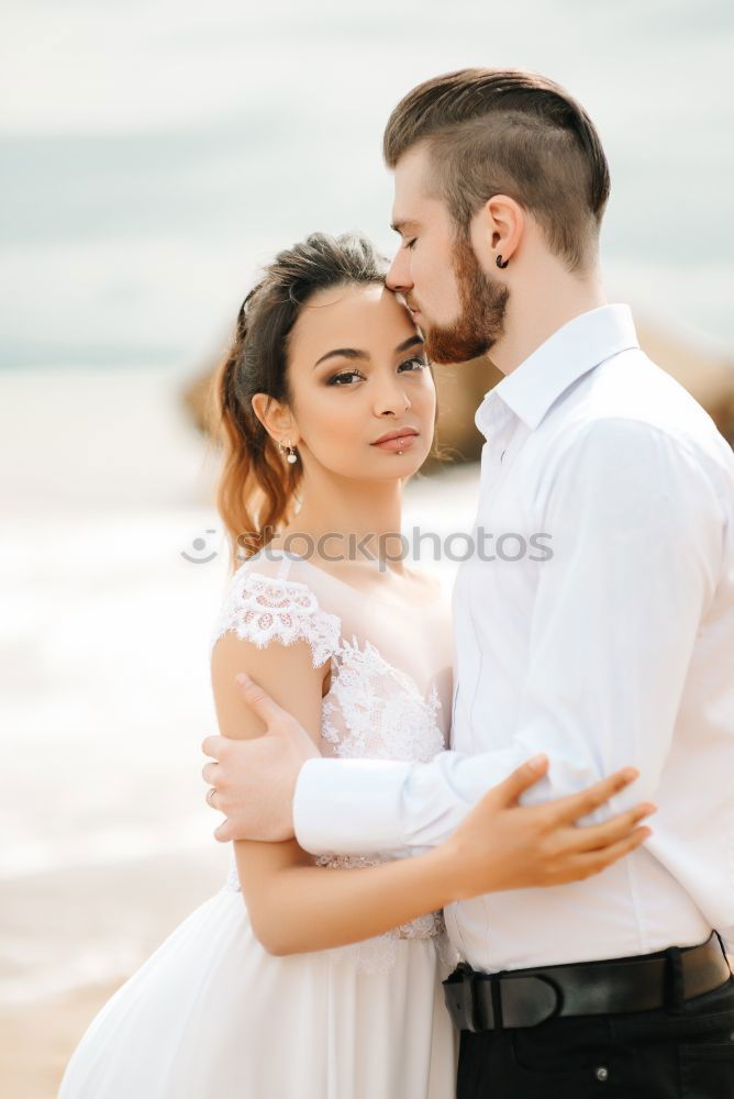 Similar – Image, Stock Photo Tender kissing bridal couple in sunlight