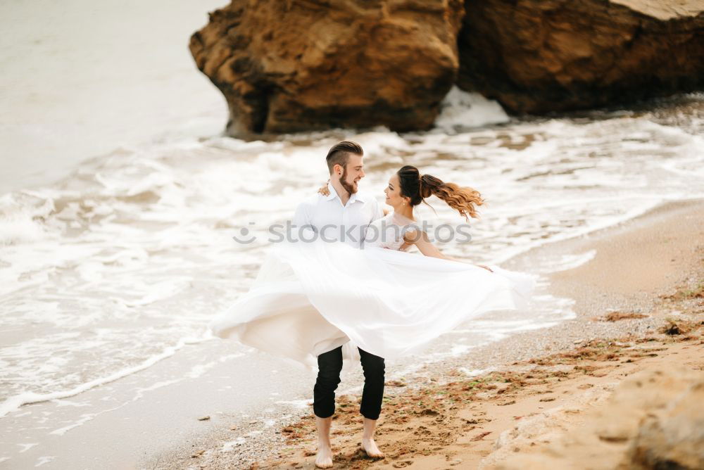 Similar – Image, Stock Photo Blonde woman and bearded man taking a walk embraced outdoors at sunset.