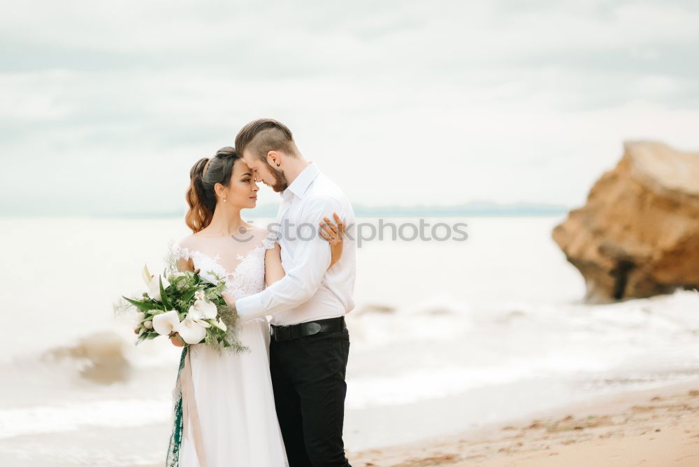 Similar – Image, Stock Photo Tender kissing bridal couple in sunlight