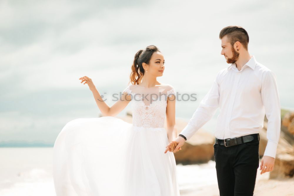 Similar – Image, Stock Photo Tender kissing bridal couple in sunlight