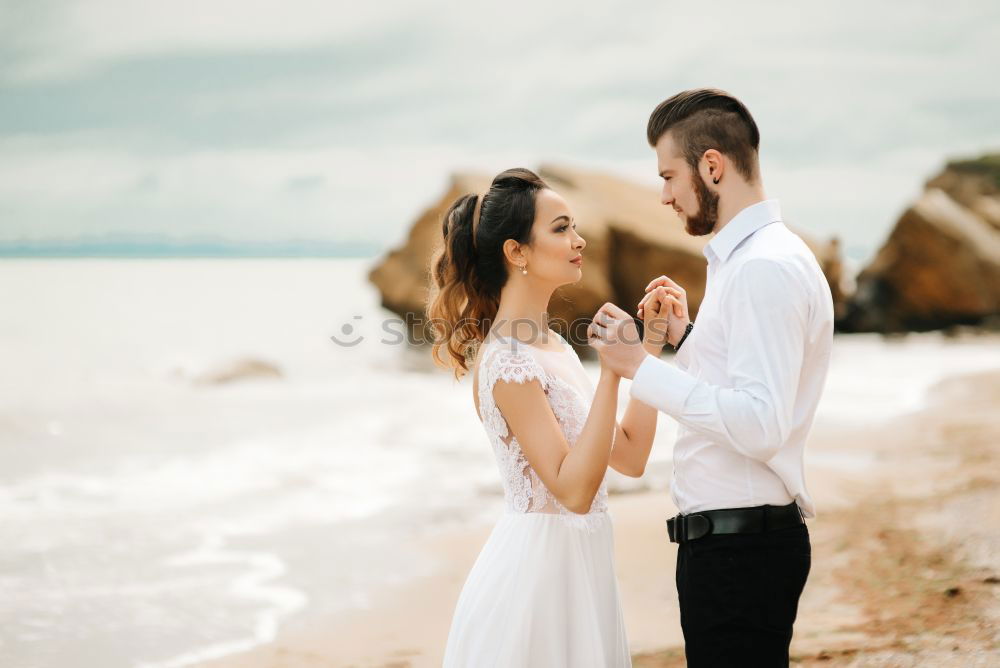 Similar – Image, Stock Photo Tender kissing bridal couple in sunlight