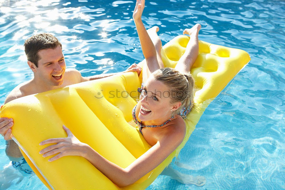 Similar – Two funny kids  in the pool on an air mattress