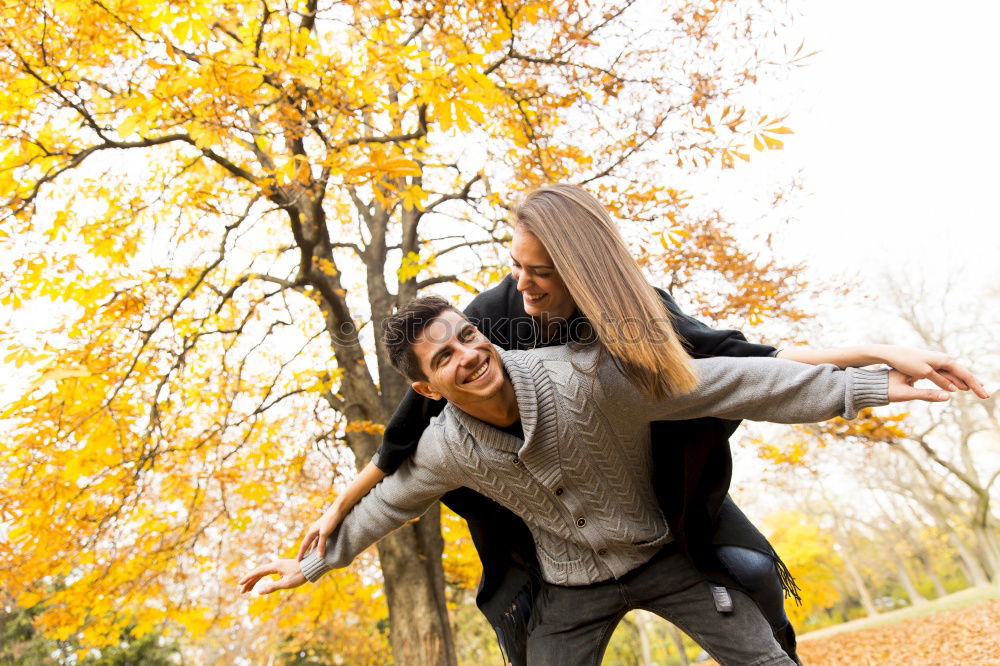 Similar – Happy girlfriend jumping on boyfriend’s back in the street