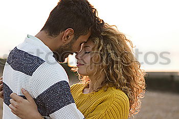 Similar – Image, Stock Photo Happy couple hugging and kissing near tree in park