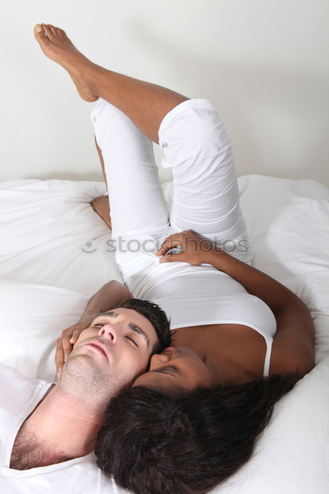 Similar – young dark skinned woman lies in lingerie on the bed and smiles into the camera