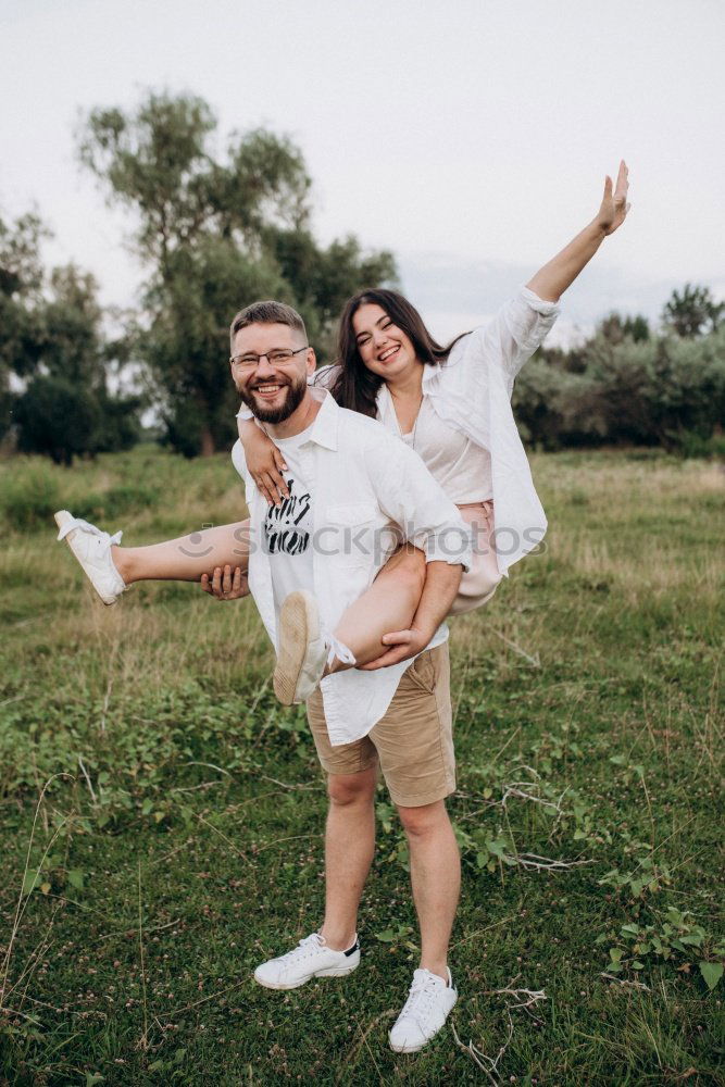 Similar – Image, Stock Photo Couple embracing on evening street