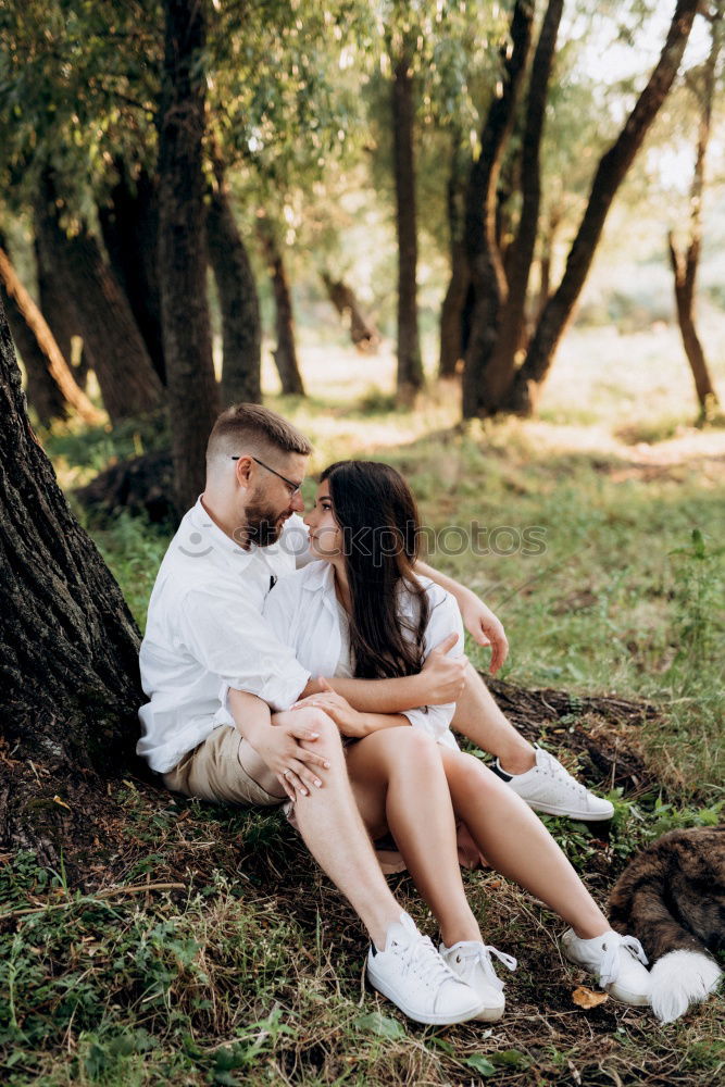 Similar – Image, Stock Photo Happy couple hugging and kissing near tree in park