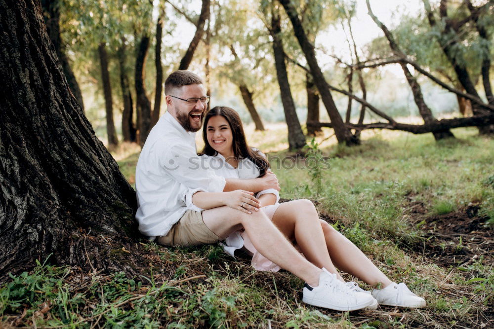 Similar – Image, Stock Photo Young couple hugging and kissing in forest