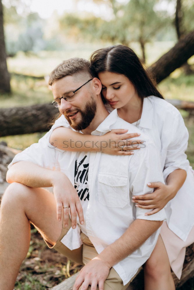 Image, Stock Photo Happy couple hugging and kissing near tree in park