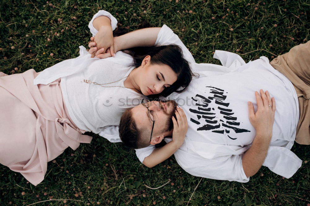 Similar – Image, Stock Photo Couple embracing on evening street