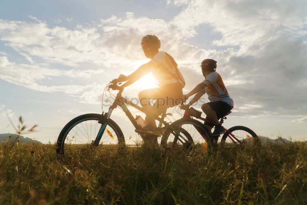 Similar – Image, Stock Photo Women on bikes giving high five