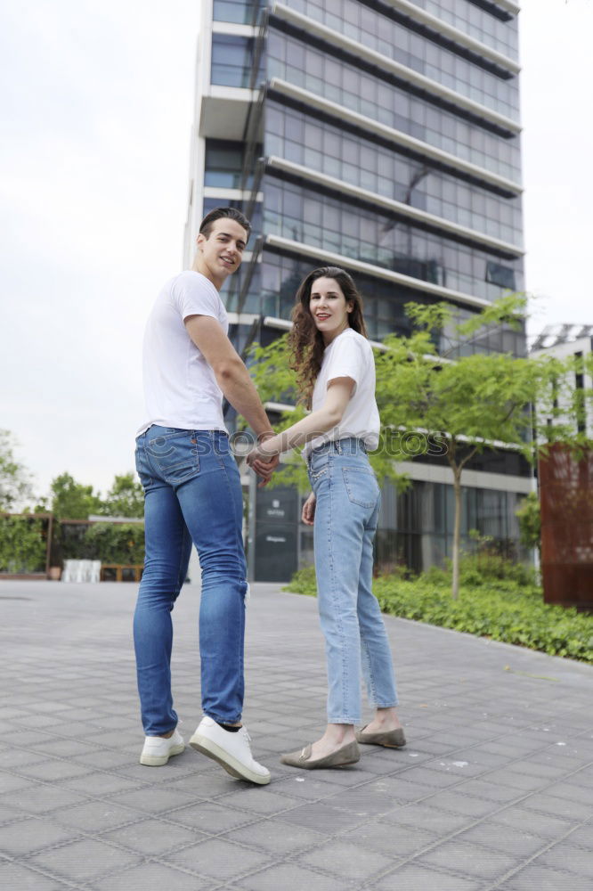 Similar – Young beautiful couple posing wearing jeans and t-shirt