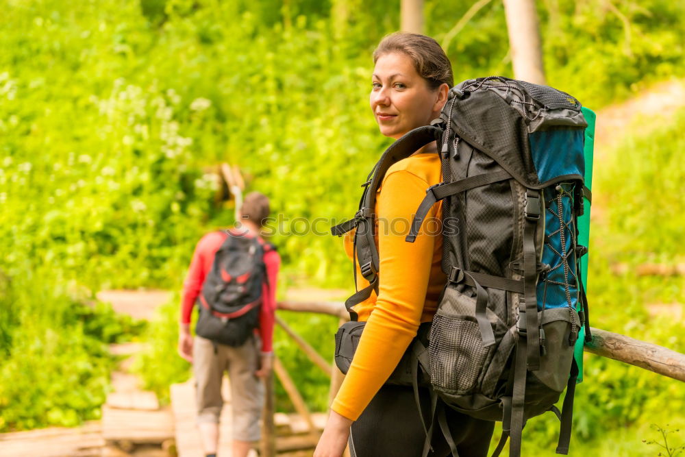 Similar – Woman doing trekking looking at camera