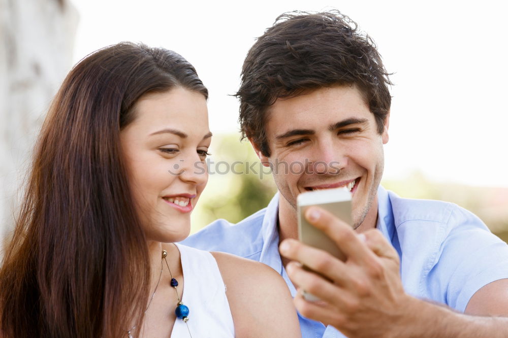 Similar – young cheerful couple taking a selfie