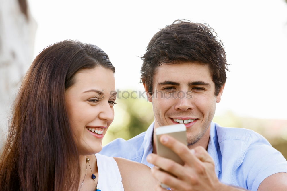 Similar – young cheerful couple taking a selfie