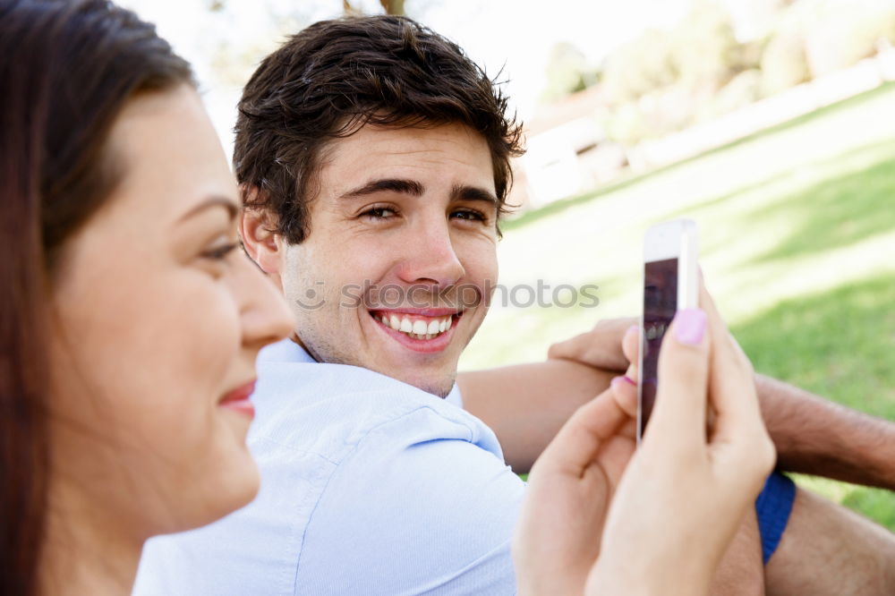 Similar – young cheerful couple taking a selfie