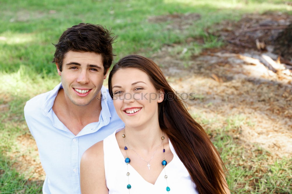 Similar – Image, Stock Photo Beautiful young couple laying on grass in an urban park