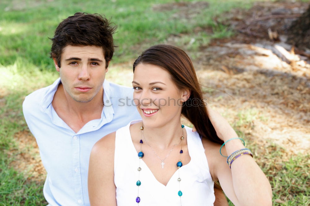 Similar – Image, Stock Photo Beautiful young couple laying on grass in an urban park