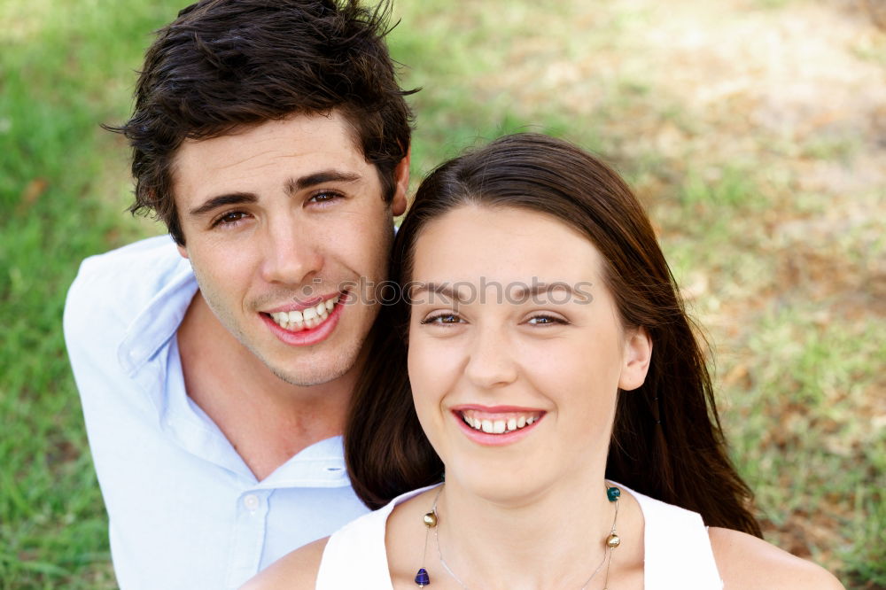 Similar – Image, Stock Photo Beautiful young couple laying on grass in an urban park