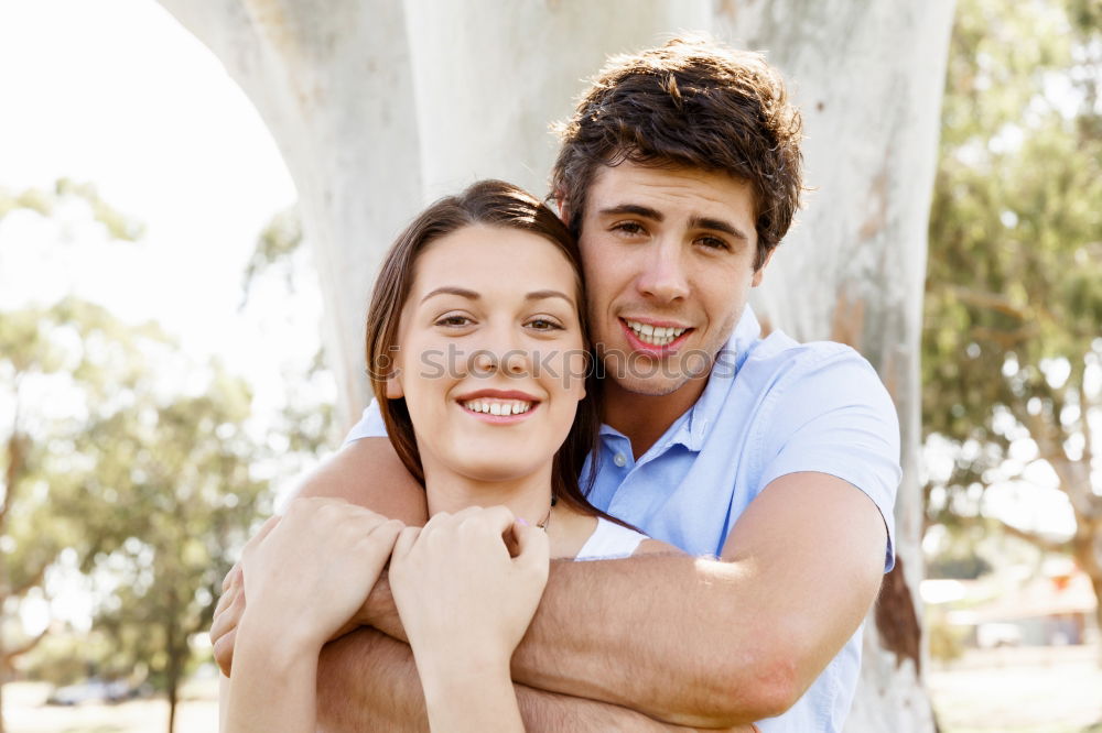 Similar – Image, Stock Photo Beautiful young couple laying on grass in an urban park