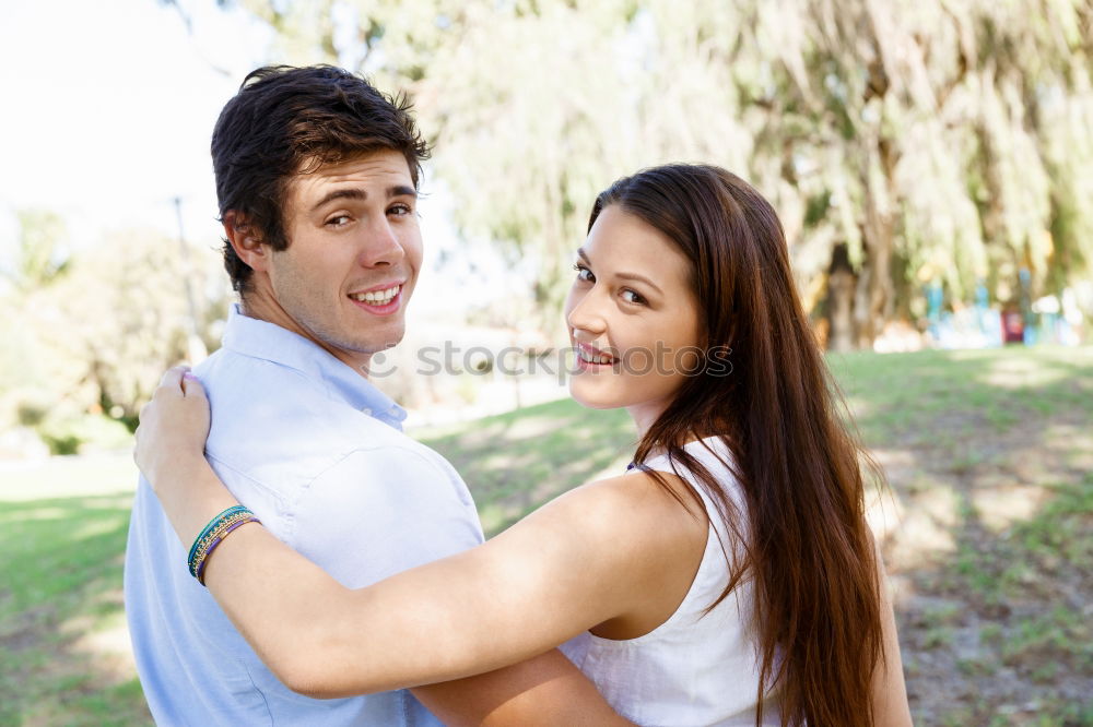 Similar – Image, Stock Photo Beautiful young couple laying on grass in an urban park