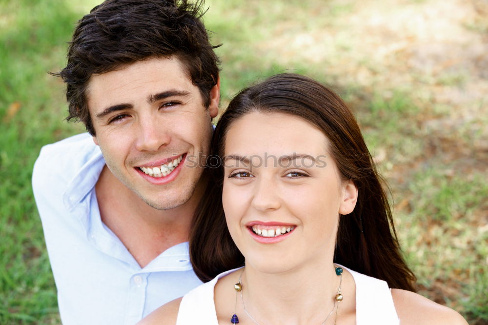 Similar – Image, Stock Photo Beautiful young couple laying on grass in an urban park