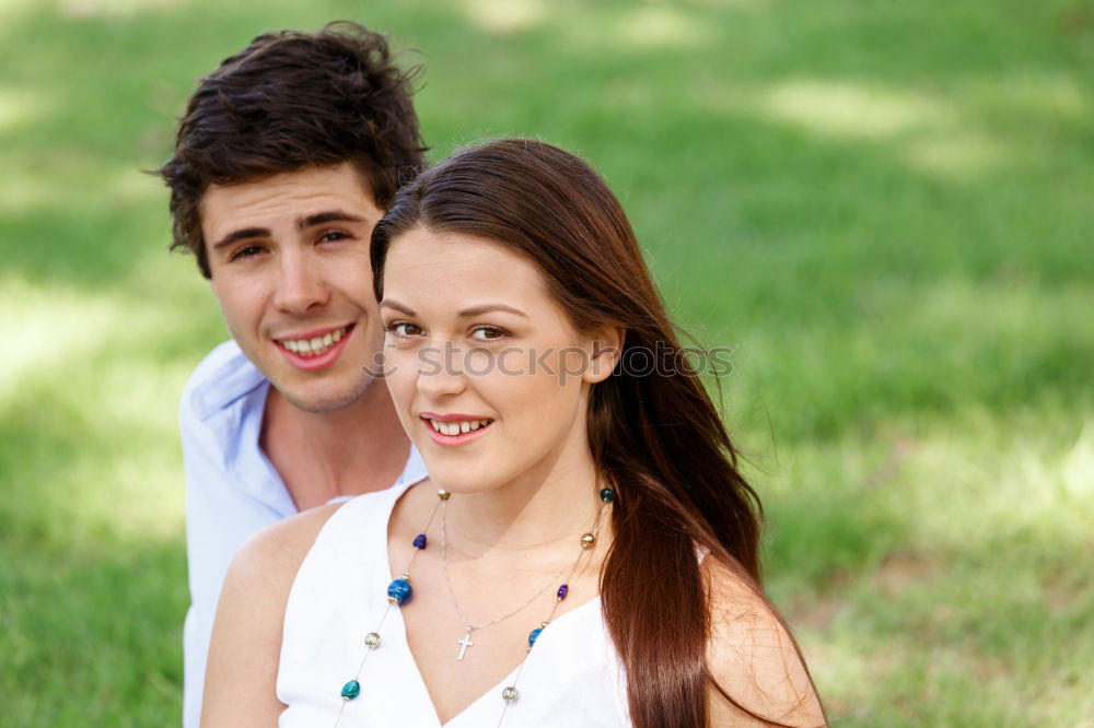 Similar – Beautiful young couple laying on grass in an urban park