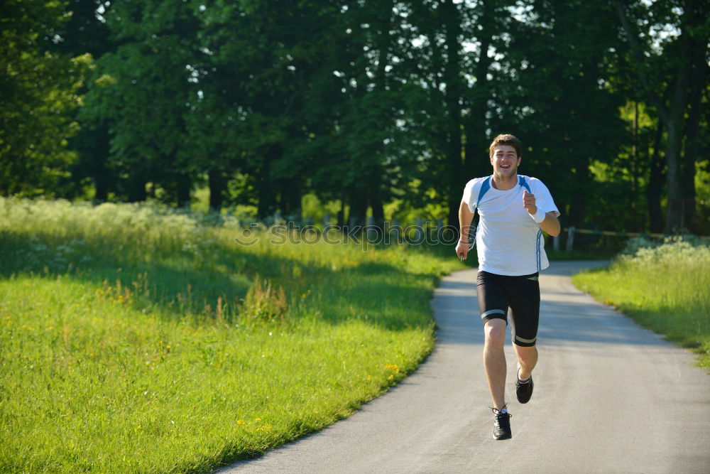 Similar – Male trail athlete posing with race number