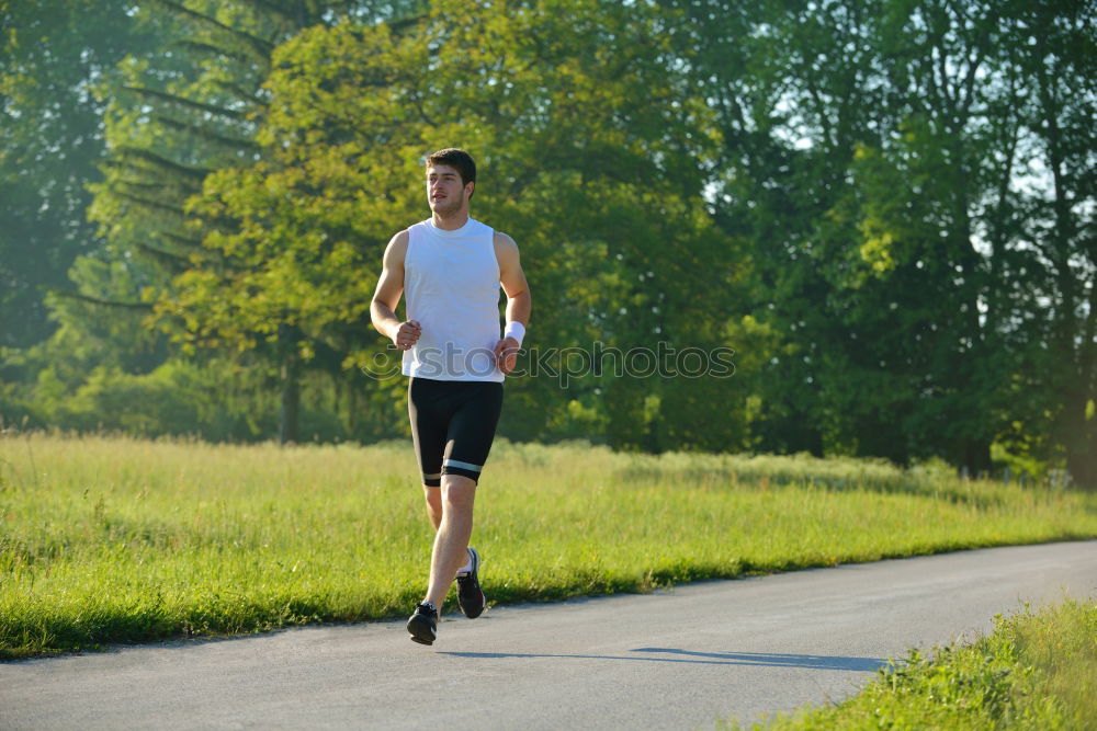 Similar – Male trail athlete posing with race number