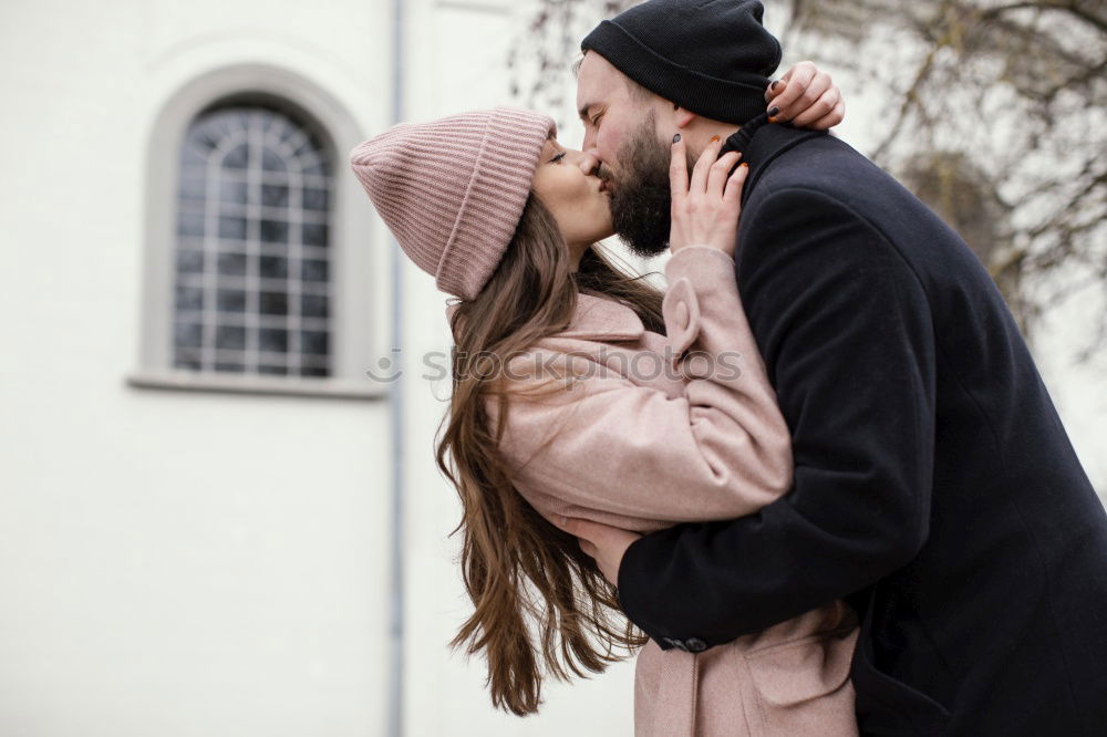 Similar – Young couple embracing and laughing outdoors under umbrella