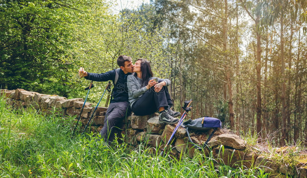 Similar – Couple of hikers doing trekking