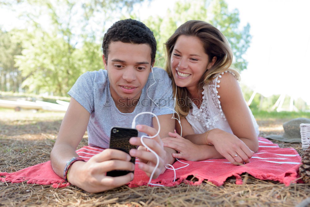 Similar – Image, Stock Photo Young couple taking selfies