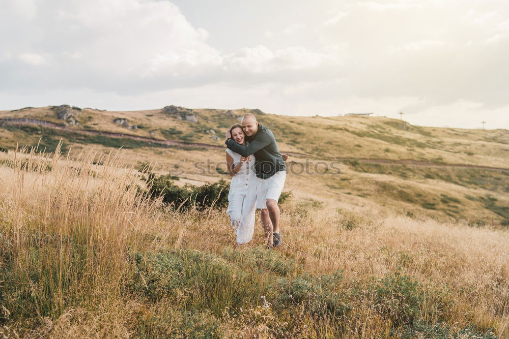 Similar – Image, Stock Photo two friends play with their dogs sitting in the meadow