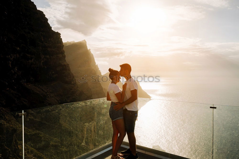 Similar – Image, Stock Photo A couple kissing in “the best bench in the world”