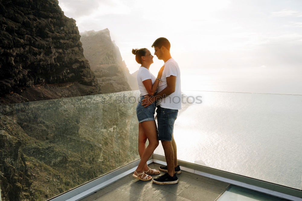 Similar – Image, Stock Photo A couple kissing in “the best bench in the world”