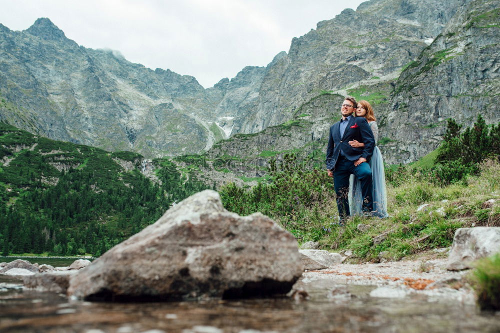 Similar – Image, Stock Photo Handsome tourist at mountain lake