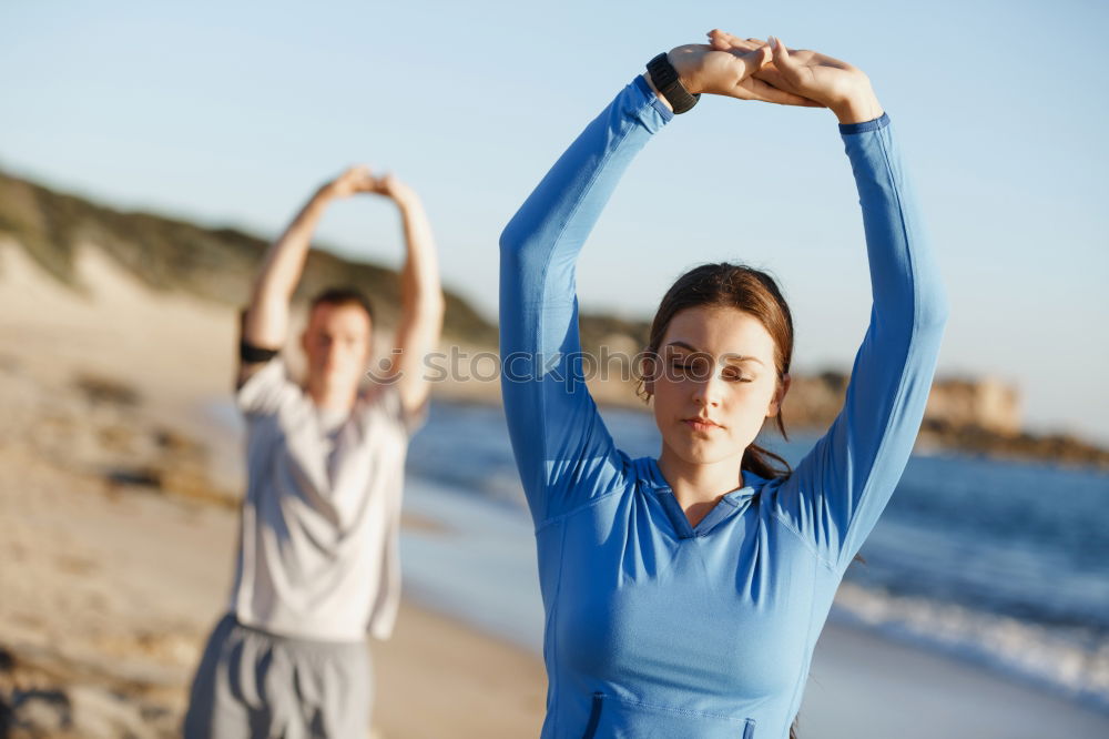 Similar – Image, Stock Photo Mother and daughter doing yoga exercises on the beach.