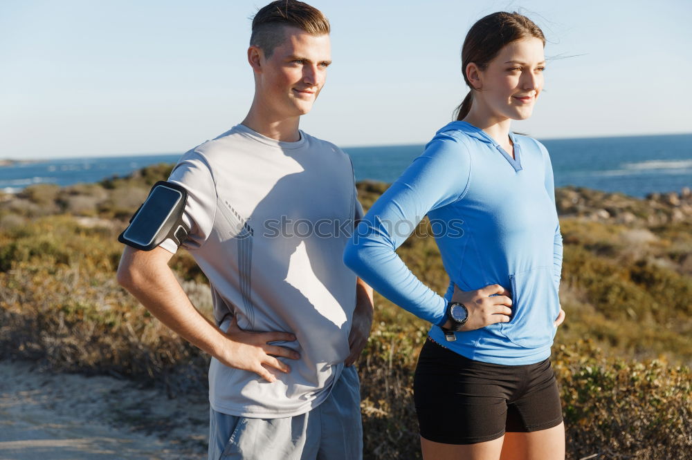 Similar – Active young couple jogging side by side in an urban street