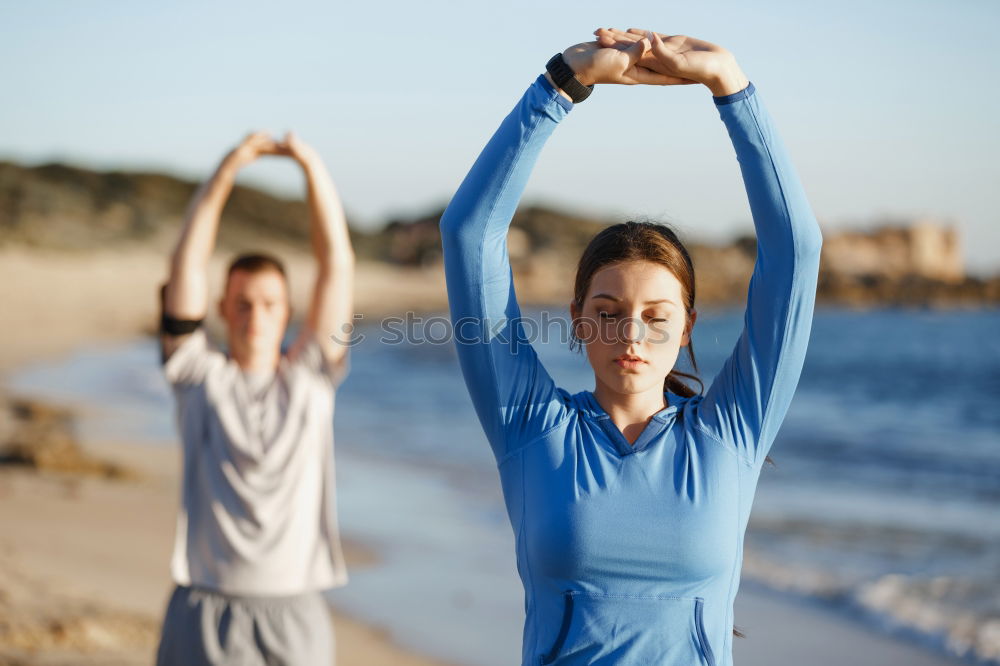 Similar – Image, Stock Photo Mother and daughter doing yoga exercises on the beach.