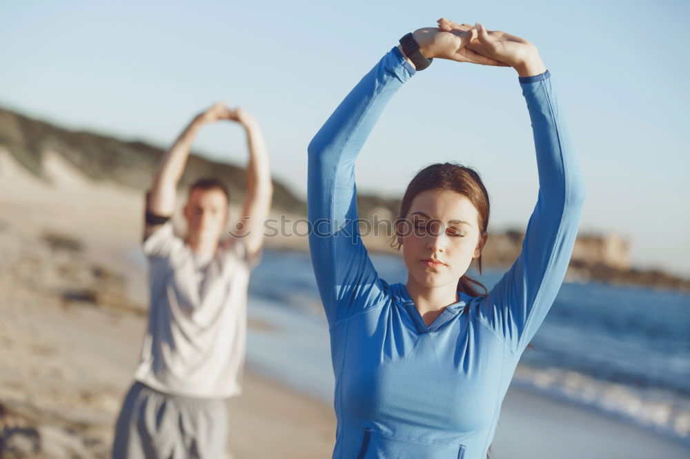 Similar – Image, Stock Photo Mother and daughter doing yoga exercises on the beach.