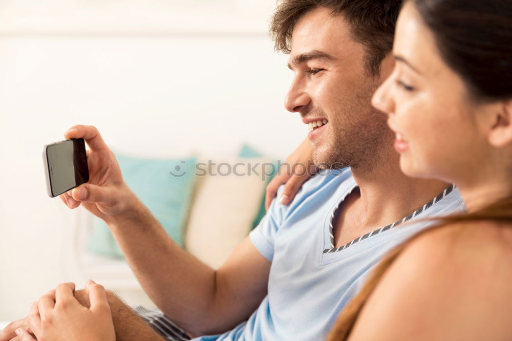 Similar – Image, Stock Photo Couple browsing on online on smartphone at home