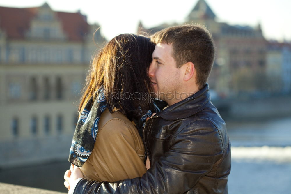 Similar – Young couple embracing and laughing outdoors under umbrella