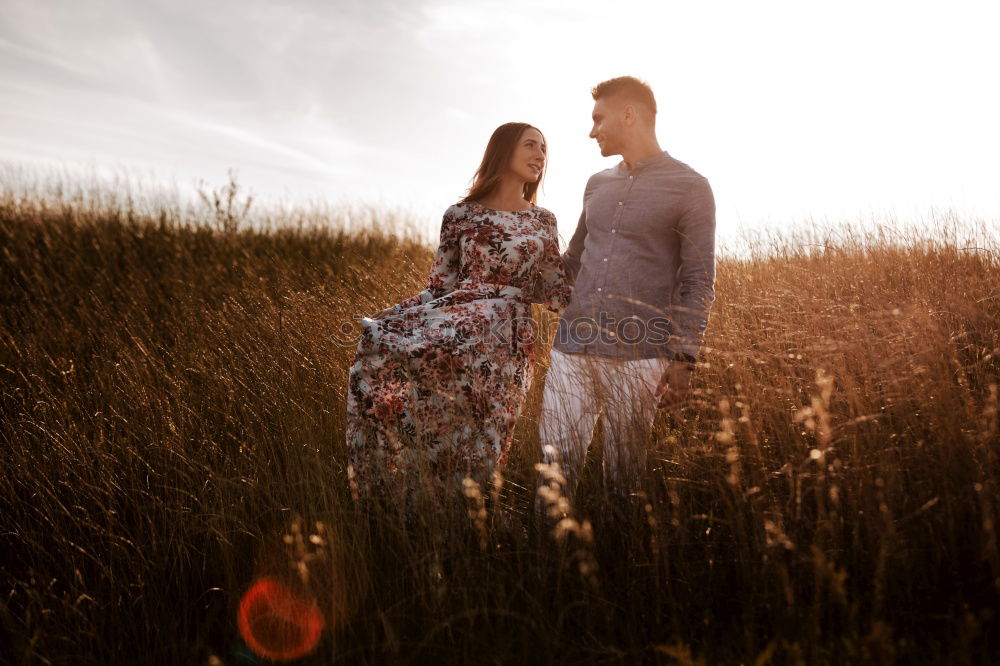 Similar – Image, Stock Photo Young adult adventerous couple hitchhiking together