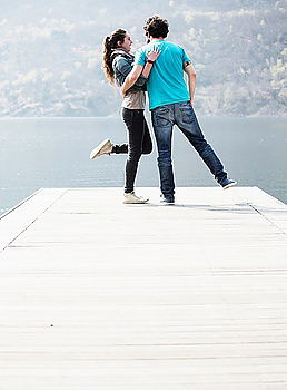 Similar – Woman carrying her friend behind her back